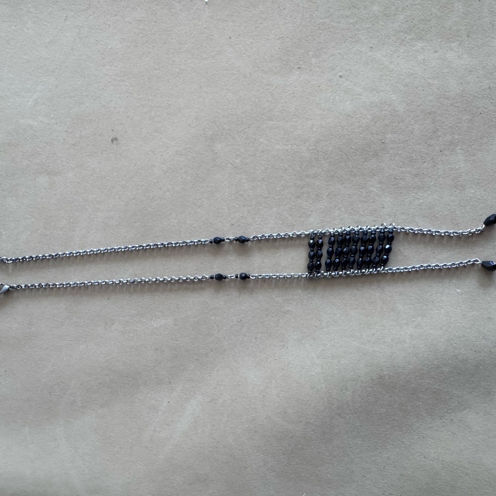 Necklace with silver-tone chains and onyx beads